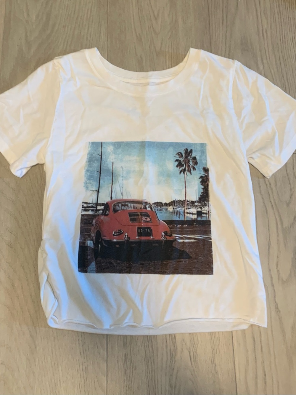 White Graphic Baby Tee with Red Car Print (Altered, fits as S)